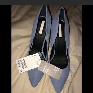 Elegant light blue real suede pumps.